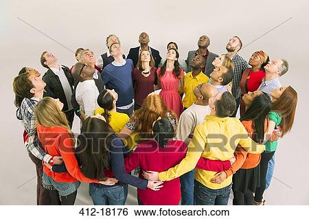 Business people forming circle and looking up View Large Photo Image Stock Photograph - Business people forming circle and looking up. Fotosearch