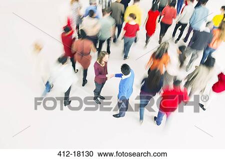Business people handshaking in crowd View Large Photo Image Stock Image - Business people handshaking in crowd. Fotosearch