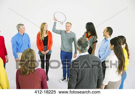 Business people watching man with thought bubble View Large Photo Image Stock Photography - Business people watching man with thought bubble. Fotosearch