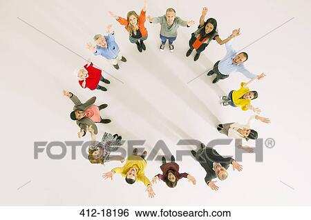 Business people with arms raised in circle View Large Photo Image Stock Photograph - Business people with arms raised in circle. Fotosearch