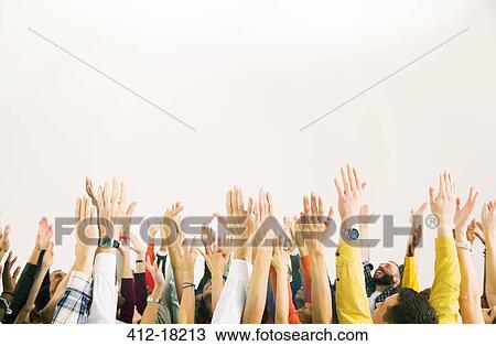 Stock Image - Business people with arms raised. Fotosearch