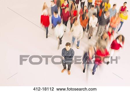 Businessman standing out from the crowd View Large Photo Image Stock Image - Businessman standing out from the crowd. Fotosearch