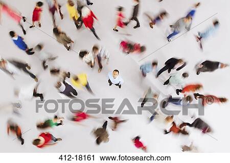 Businessman standing out from the crowd View Large Photo Image Stock Image - Businessman standing out from the crowd. Fotosearch