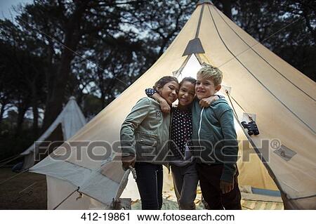 Children hugging by teepee at campsite View Large Photo Image Stock Image - Children hugging by teepee at campsite . Fotosearch