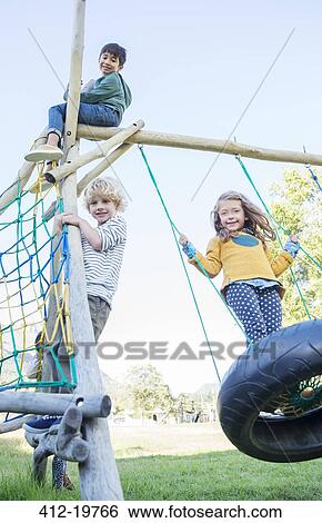 Children playing on play structure View Large Photo Image Stock Photograph - Children playing on play structure. Fotosearch