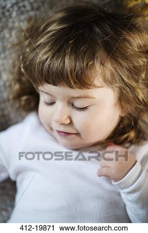 Close up of sleeping girl's face View Large Photo Image Stock Image - Close up of sleeping girl's face. Fotosearch