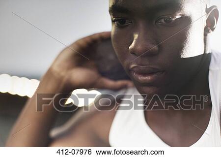 Close up of track and field athlete holding shot put View Large Photo Image Stock Photograph - Close up of track and field athlete holding shot put. Fotosearch