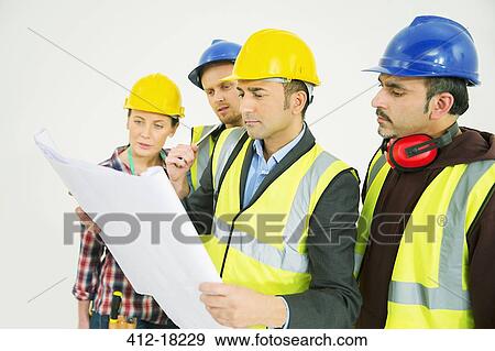 Stock Photo - Construction workers viewing blueprints. Fotosearch