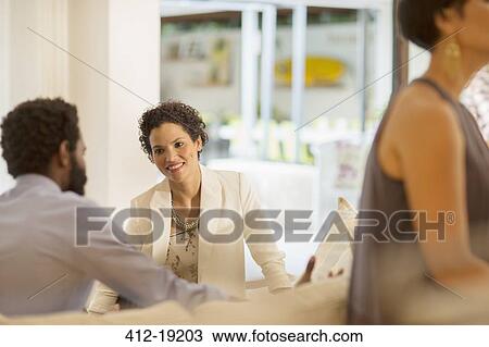 Couple talking at party View Large Photo Image Stock Image - Couple talking at party. Fotosearch