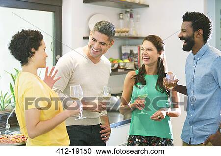 Couples talking at party View Large Photo Image Stock Image - Couples talking at party. Fotosearch