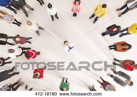 Crowd around businessman with arms crossed View Large Photo Image Stock Image - Crowd around businessman with arms crossed. Fotosearch