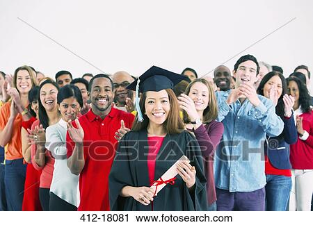Crowd clapping behind happy graduate View Large Photo Image Stock Image - Crowd clapping behind happy graduate. Fotosearch