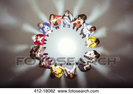 Crowd forming circle around bright light View Large Photo Image Stock Image - Crowd forming circle around bright light. Fotosearch