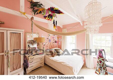 Stock Image - Decorations in bedroom of rustic house. Fotosearch