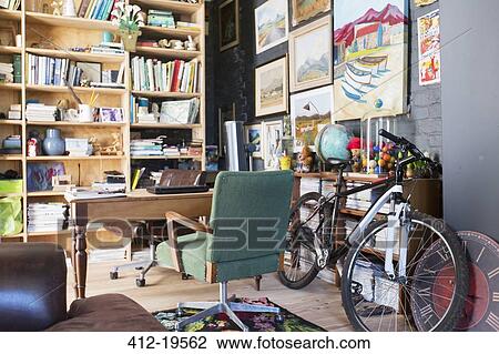 Desk, bookshelves and bicycle in study View Large Photo Image Stock Image - Desk, bookshelves and bicycle in study. Fotosearch