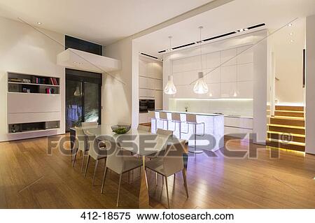Dining area and kitchen in modern house View Large Photo Image Stock Photography - Dining area and kitchen in modern house. Fotosearch