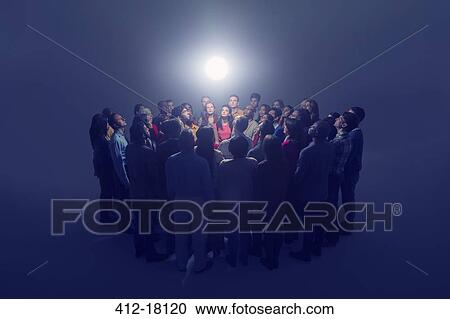 Diverse crowd around bright light View Large Photo Image Stock Image - Diverse crowd around bright light. Fotosearch