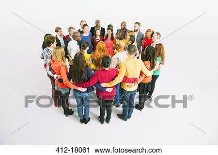 Diverse crowd in huddle View Large Photo Image Stock Image - Diverse crowd in huddle. Fotosearch