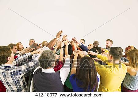 Diverse crowd in huddle View Large Photo Image Stock Photo - Diverse crowd in huddle. Fotosearch