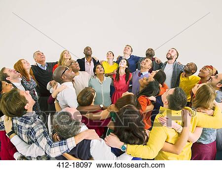Diverse crowd in huddle View Large Photo Image Stock Photo - Diverse crowd in huddle. Fotosearch