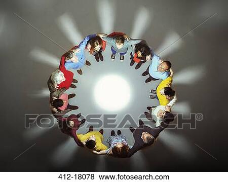 Diverse group around bright light View Large Photo Image Stock Photo - Diverse group around bright light. Fotosearch