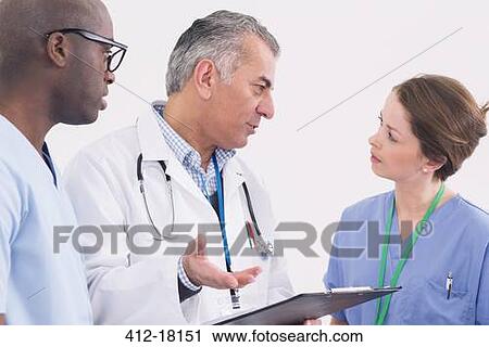Doctor and nurses talking View Large Photo Image Stock Image - Doctor and nurses talking. Fotosearch