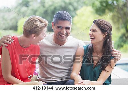 Friends relaxing together outdoors View Large Photo Image Picture - Friends relaxing together outdoors. Fotosearch