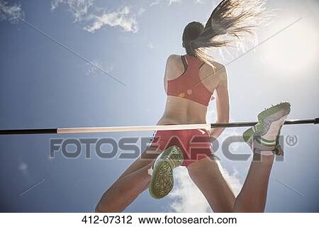 High jumper clearing bar View Large Photo Image Stock Image - High jumper clearing bar. Fotosearch