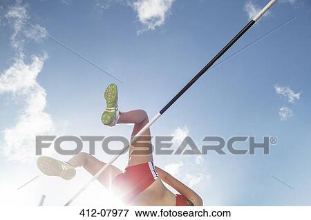High jumper clearing bar View Large Photo Image Stock Photo - High jumper clearing bar. Fotosearch