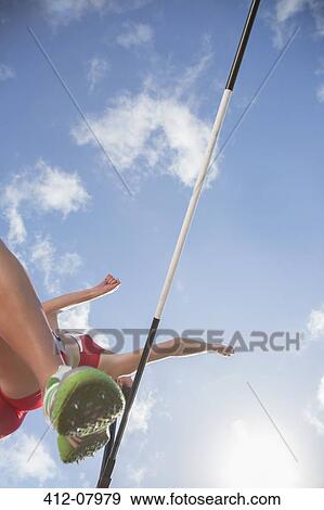 High jumper clearing bar View Large Photo Image Stock Photo - High jumper clearing bar. Fotosearch