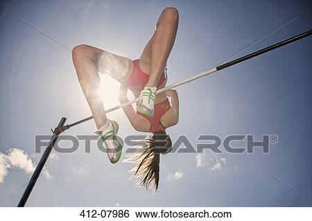 High jumper clearing bar View Large Photo Image Stock Photograph - High jumper clearing bar. Fotosearch