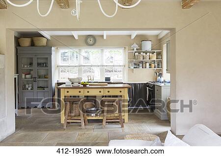 Island in kitchen of rustic house View Large Photo Image Stock Photograph - Island in kitchen of rustic house. Fotosearch