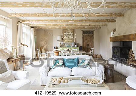 Living and dining area in rustic house View Large Photo Image Stock Photo - Living and dining area in rustic house. Fotosearch