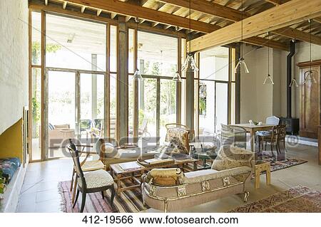 Living and dining area of rustic house View Large Photo Image Stock Photograph - Living and dining area of rustic house. Fotosearch