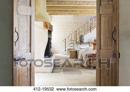 Stock Image - Living room in rustic house. Fotosearch
