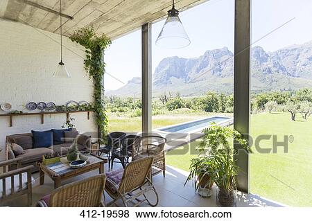 Living room overlooking backyard and landscape View Large Photo Image Stock Photo - Living room overlooking backyard and landscape. Fotosearch