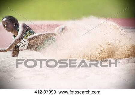 Long jumper landing in sand View Large Photo Image Stock Image - Long jumper landing in sand. Fotosearch