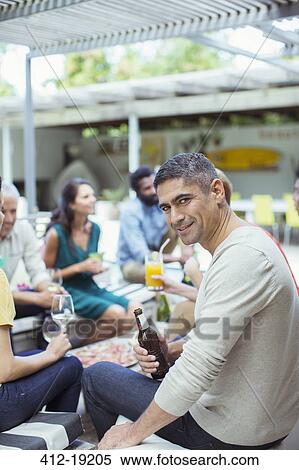 Man smiling at party View Large Photo Image Stock Photography - Man smiling at party. Fotosearch