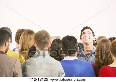Man standing out from the crowd View Large Photo Image Stock Photography - Man standing out from the crowd. Fotosearch