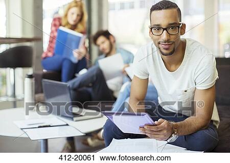 Man using digital tablet in office View Large Photo Image Stock Image - Man using digital tablet in office. Fotosearch