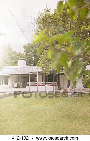 Manicured front lawn of modern house View Large Photo Image Stock Photo - Manicured front lawn of modern house. Fotosearch