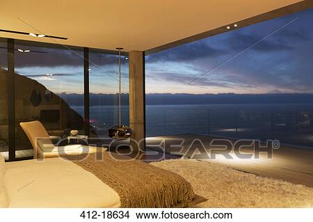 Picture - Modern bedroom overlooking ocean. Fotosearch