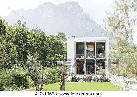 Stock Image - Modern house in rural landscape. Fotosearch