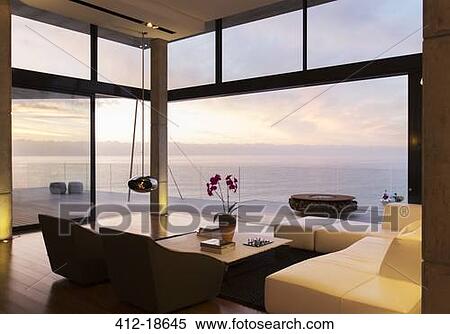Modern living room overlooking ocean View Large Photo Image Stock Photography - Modern living room overlooking ocean. Fotosearch