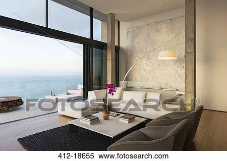 Stock Photography - Modern living room overlooking ocean. Fotosearch