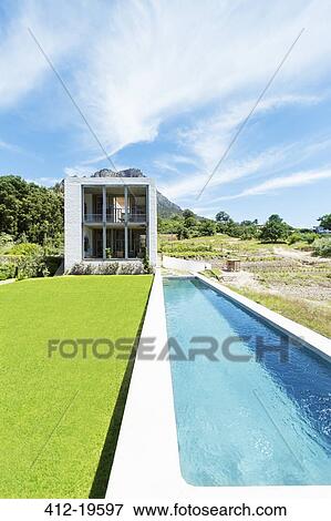 Modern swimming pool under blue sky View Large Photo Image Stock Photo - Modern swimming pool under blue sky. Fotosearch