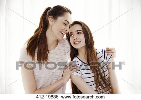 Mother and daughter hugging View Large Photo Image Stock Photograph - Mother and daughter hugging. Fotosearch