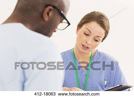 Nurse talking with patient View Large Photo Image Stock Image - Nurse talking with patient. Fotosearch
