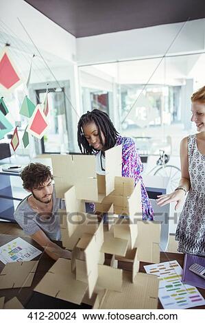 People building model in office View Large Photo Image Picture - People building model in office. Fotosearch