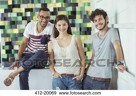 People smiling together in office View Large Photo Image Stock Photo - People smiling together in office. Fotosearch